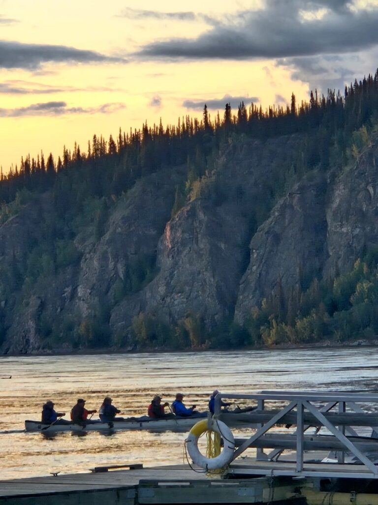 The Skagway Swinging Sixties finish under the midnight sun in Dawson City. See results at yukonriverquest.com. Photo by Brian Larson